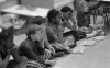 Young Kids Sitting on Classroom Floor
